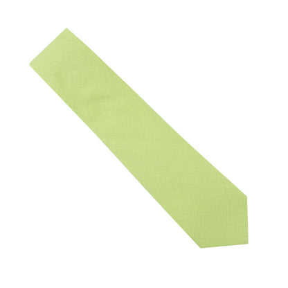 A Lime Green Cotton Skinny Tie lies on a simple white backdrop, infusing playful styles with a hint of spring.