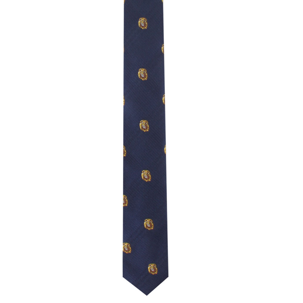 The King Lion Skinny Tie is a navy blue accessory adorned with a pattern of small, circular, golden designs that discreetly incorporate a lion motif, symbolizing courage.