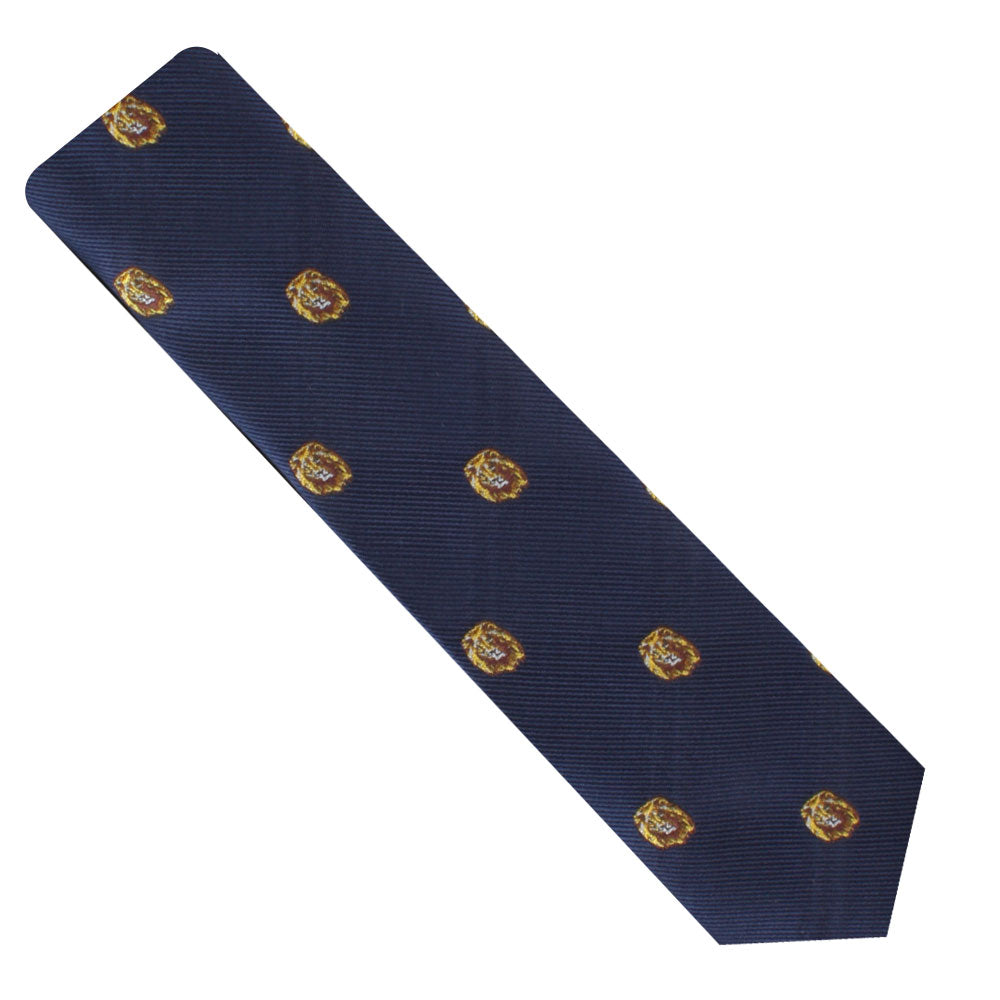 The King Lion Skinny Tie is a navy blue accessory adorned with small heraldic shield designs in yellow and red, each featuring a lion motif symbolizing courage and leadership.