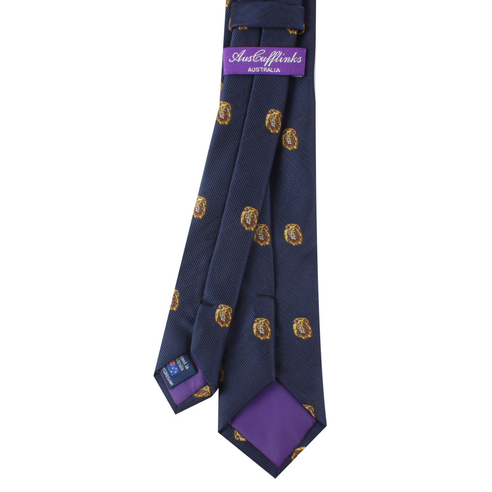 The King Lion Skinny Tie, featuring a dark blue background adorned with a gold lion motif symbolizing leadership and courage, comes complete with a purple label at the back inscribed with "Australia".