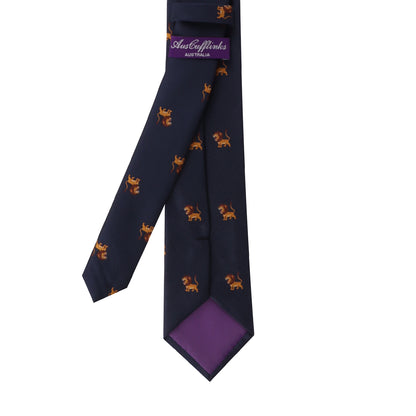 A Lion Head necktie, a navy blue necktie with small, orange lion motifs and a purple inner lining, perfect for the leader in style.