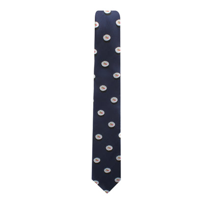 A sleek Maki Roll Necktie featuring dark blue fabric adorned with a modern repeating pattern of small, circular designs.