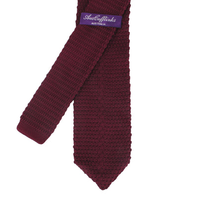 A Maroon Skinny Necktie with a textured pattern is showcased against a white background, exuding cozy elegance. The warm hues complement the sophisticated design. The label reads "AusCufflinks Australia".