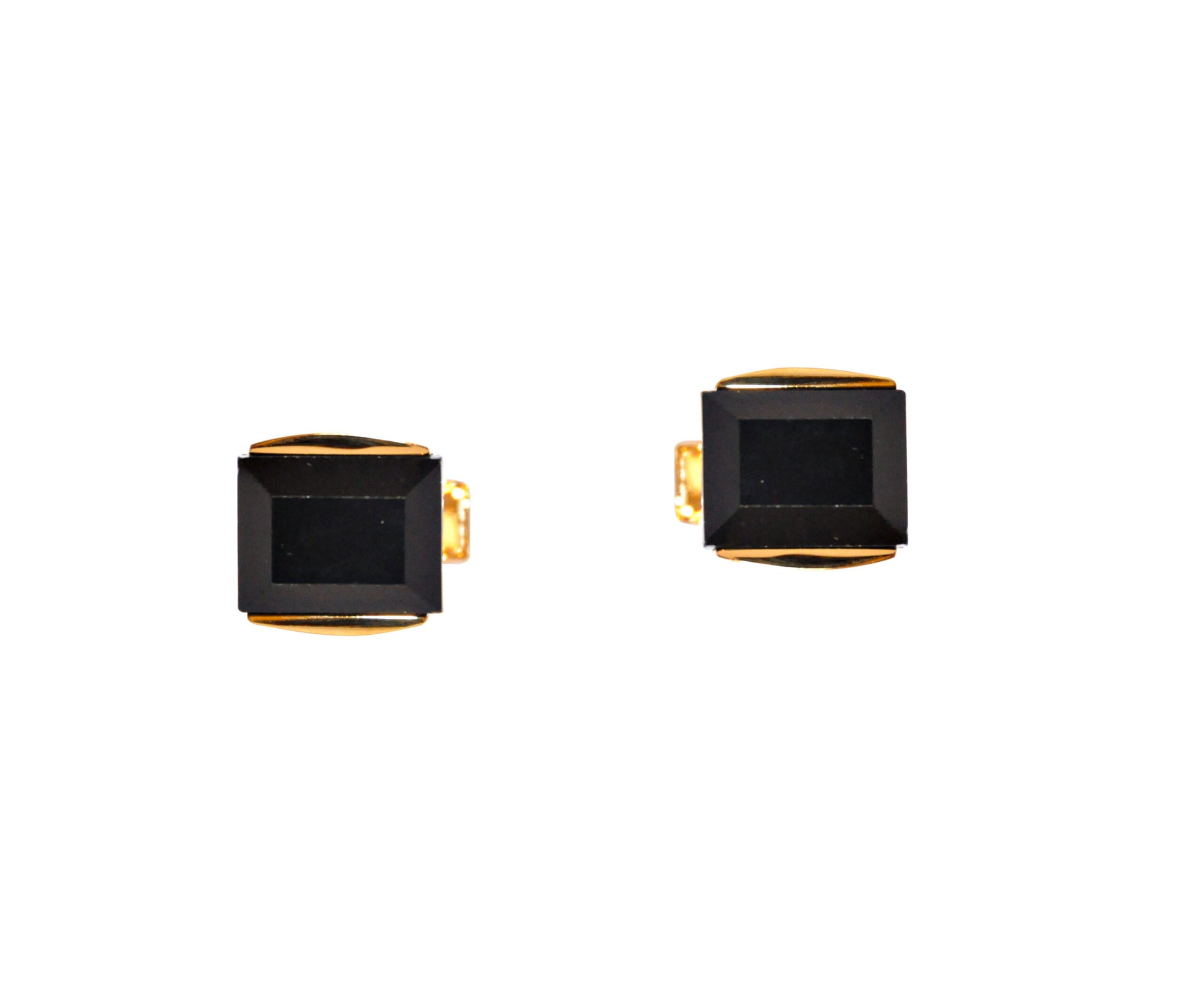 A set of black & gold clasp cufflinks exudes modern charm and elegance against a white background.