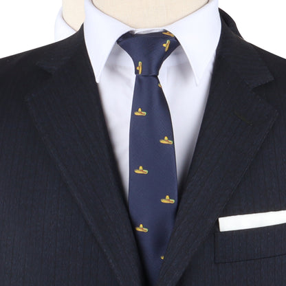Close-up of a mannequin wearing a dapper design: a dark pinstripe suit, white shirt, and the Sombrero Skinny Tie, which is navy with small yellow submarine motifs.