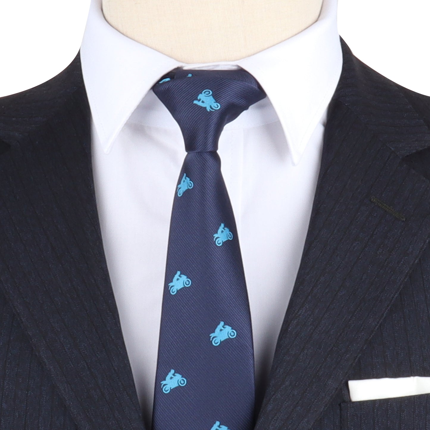 Close-up of a person wearing a dark pinstripe suit with a white dress shirt and a ride-inspired blue Motorbike Enthusiast Tie, adding a touch of boldness to the ensemble.