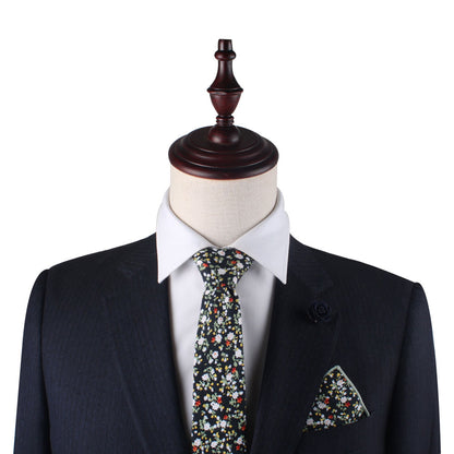 Mannequin showcasing business finesse in a dark suit paired with a white shirt, Multi Floral Skinny Cotton Tie, and matching pocket square.