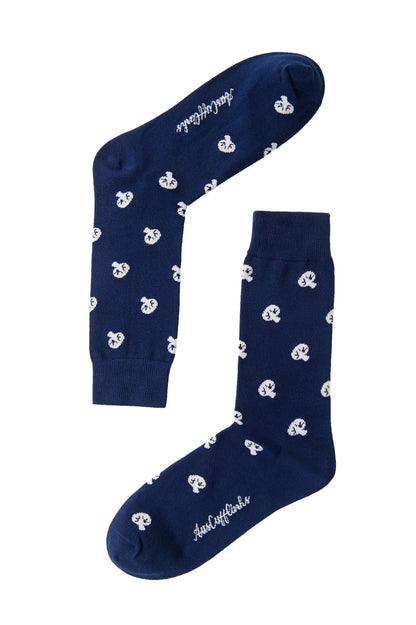 Two Mushroom Socks in navy blue, featuring white panda bear patterns and brand name text, add a touch of forest flair to your feet. They are artfully displayed in opposite directions against a white background.