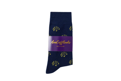 A pair of navy blue Musical Note Socks with yellow bicycle motifs and feet-harmonizing purple brand label.