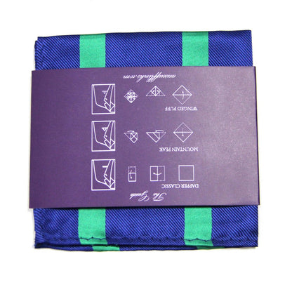 A folded navy and green pocket square from the Navy Green Stripe Business Tie & Pocket Square Set, featuring a purple wrapping with illustrated folding instructions, exuding polished charm.