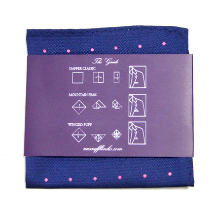 The Navy Pink Polka Dot Business Tie & Pocket Square Set includes a navy pocket square with pink dots, complemented by an instructional card that demonstrates three folding styles: Dapper Classic, Mountain Peak, and Winged Puff, which infuse sophistication into any outfit.