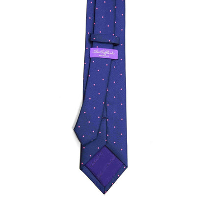 Men’s navy skinny tie with pink dots, stylish accessory for business wear, weddings, and special events.