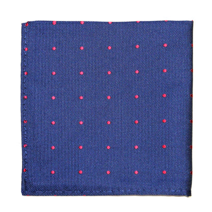 The Navy Red Polka Dot Business Tie & Pocket Square Set features a neatly folded navy blue pocket square with small red polka dots on a plain white background.