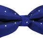 The Navy White Polka Dot Bow Tie exudes nautical vibes with its navy blue fabric adorned with white polka dots against a pristine white background.