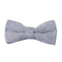 The Navy Blue Herringbone Cotton Bow Tie & Pocket Square Set from AusCufflinks features a stylish herringbone pattern that adds charm and style against a sophisticated backdrop.