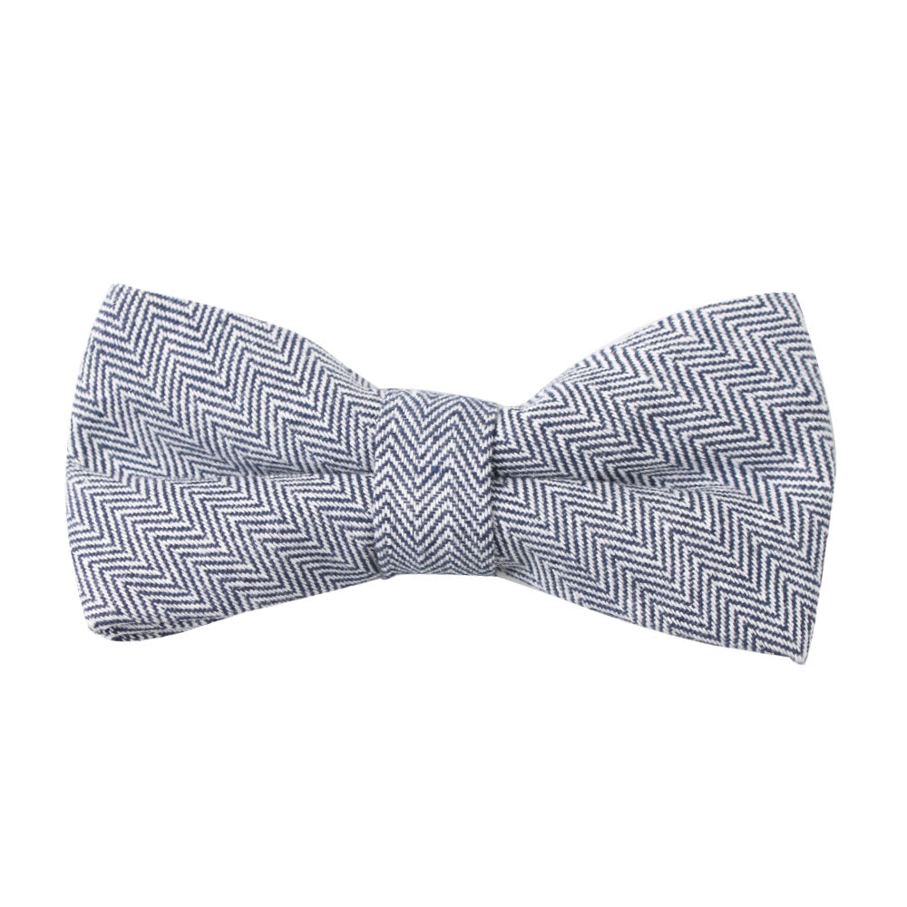 The Navy Blue Herringbone Cotton Bow Tie & Pocket Square Set from AusCufflinks features a stylish herringbone pattern that adds charm and style against a sophisticated backdrop.