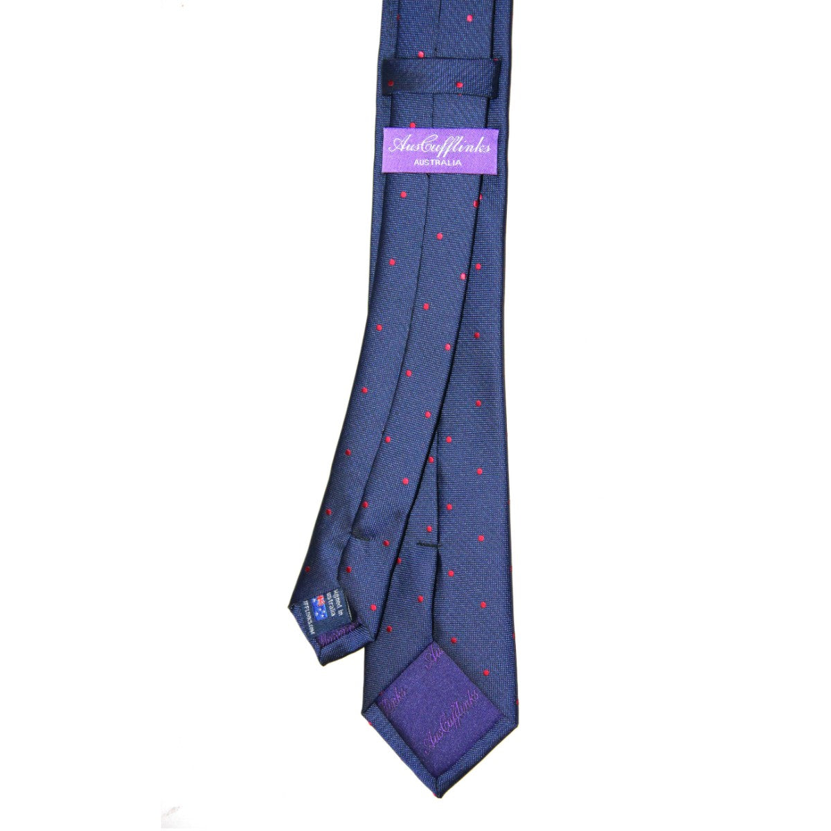 Enhance your style with the Navy Red Polka Dot Business Tie & Pocket Square Set, made from dark blue silk with tiny red spots and a refined purple "SilkCufflinks Australia" label.