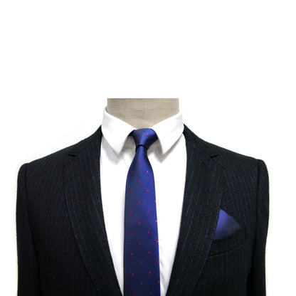 The navy pinstripe suit on the mannequin is a men's fashion essential, styled with a crisp white shirt and a blue tie adorned with red dots. Completing this formal ensemble against the white backdrop is the Navy Red Polka Dot Pocket Square for an added touch of elegance.