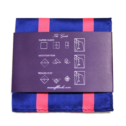 Enhance your style with our Navy Reddish Pink Stripe Business Tie & Pocket Square Set. The pocket square, featuring a blue and red stripe pattern, is part of the Modern Gentleman Accessories collection and includes instructions for "Dapper Classic," "Mountain Peak," and "Winged Puff.