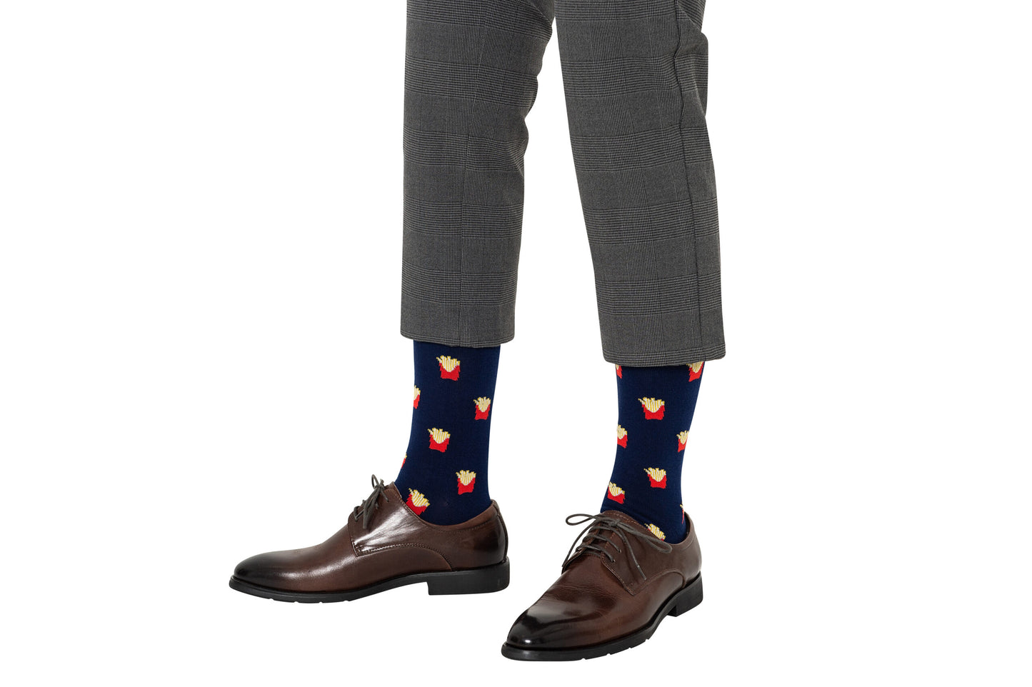 A person wearing gray plaid pants, brown dress shoes, and Fries Socks with a realistic navy blue fries print.