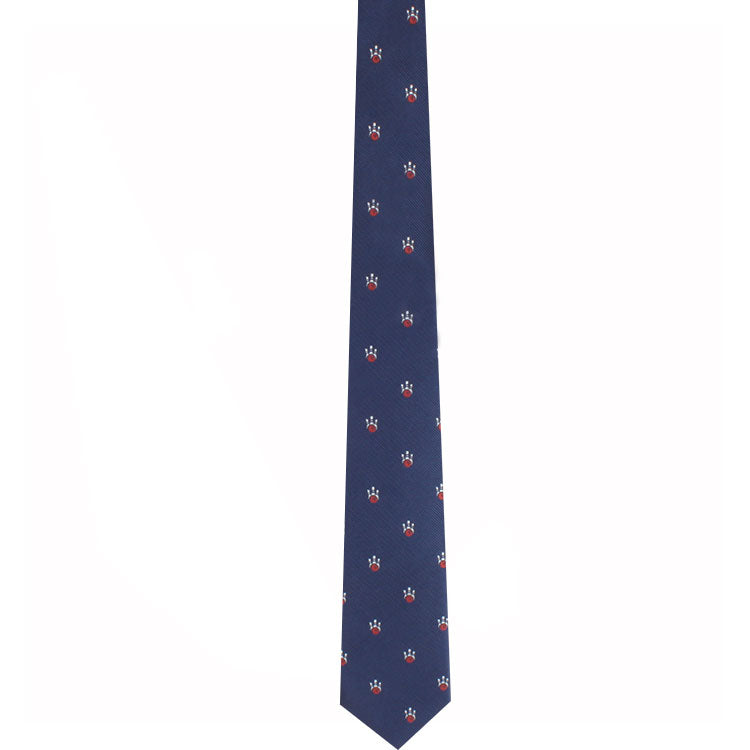 Elevate your look with our Ten Pin Bowling Pin Tie, a dark blue necktie adorned with a pattern of small red and white flower-like designs, evenly spaced to add a touch of refined style.