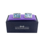 A pair of Ocean Blue Mosaic Cufflinks is displayed on a navy box with "AUSCufflinks" printed on it, exuding an air of sophistication.