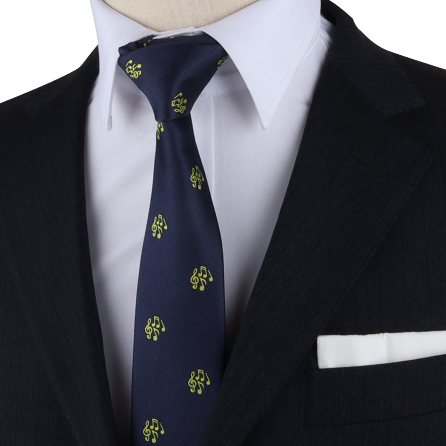 Mannequin dressed in a black suit, white shirt, and the Orchestra Necktie adorned with yellow patterns, effortlessly harmonizing the look with a white pocket square.