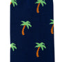 A close-up image of the Palm Tree Socks in dark blue, adorned with small green and brown palm tree patterns, bringing tropical vibes to your toes.