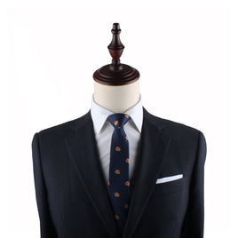 Mannequin torso displaying a navy suit with a Pancakes Slim Tie and pocket square.
