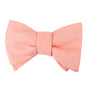 The Pink Orange Self Tie Bow Tie features a vibrant, slightly textured fabric and can be neatly tied for a polished look.