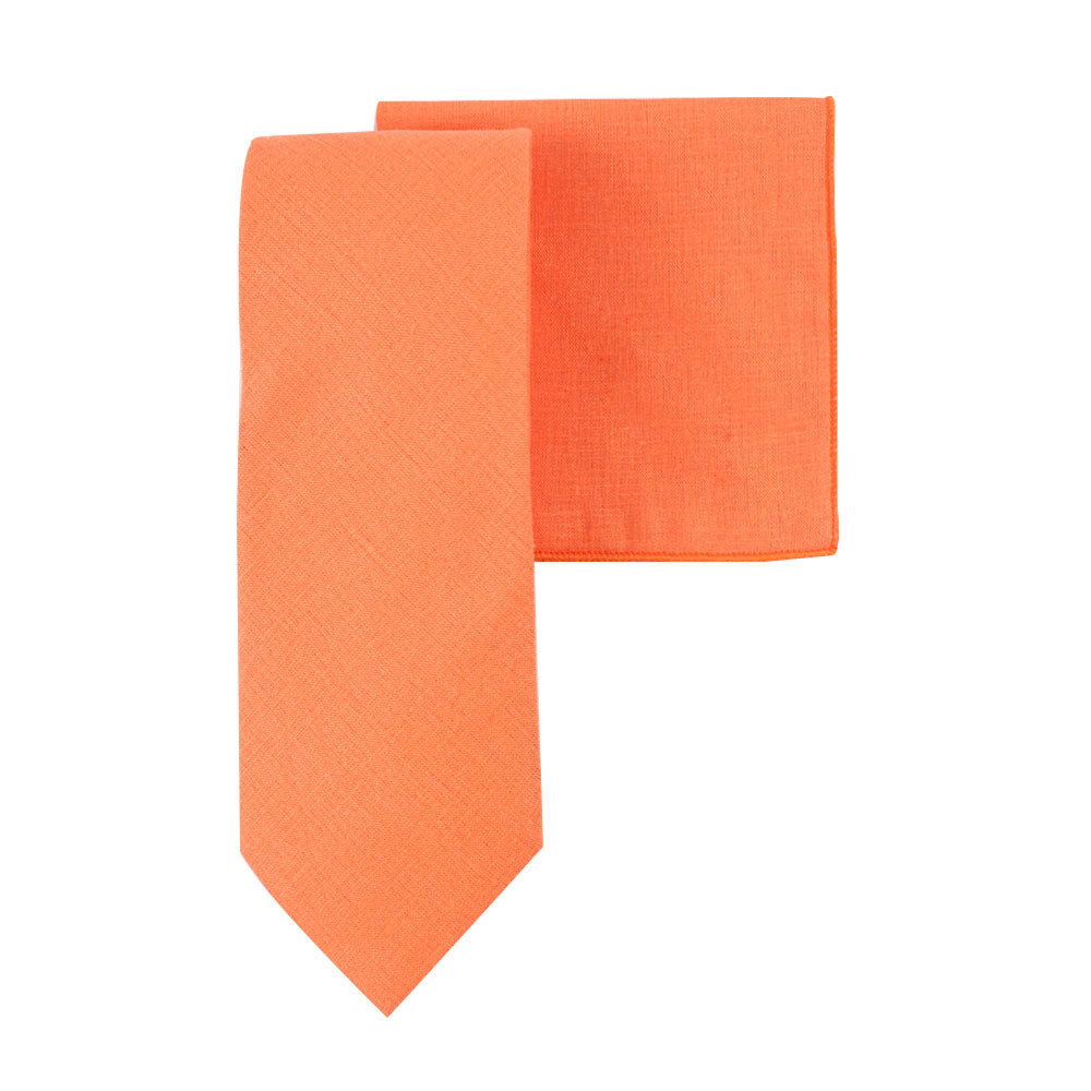 Product: The Peach Orange Cotton Skinny Tie & Pocket Square Set offers a sophisticated and smooth texture, combining the tie and a matching pocket square in vibrant sunny hues.