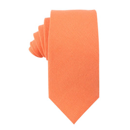 Featuring a textured finish and neatly folded design, the Peach Orange Cotton Business Tie & Pocket Square Set stands out stylishly against a white background.