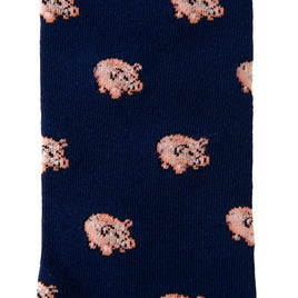 The Pig Socks in navy blue feature a delightful pattern of small pink pig illustrations, merging comfort with style effortlessly.