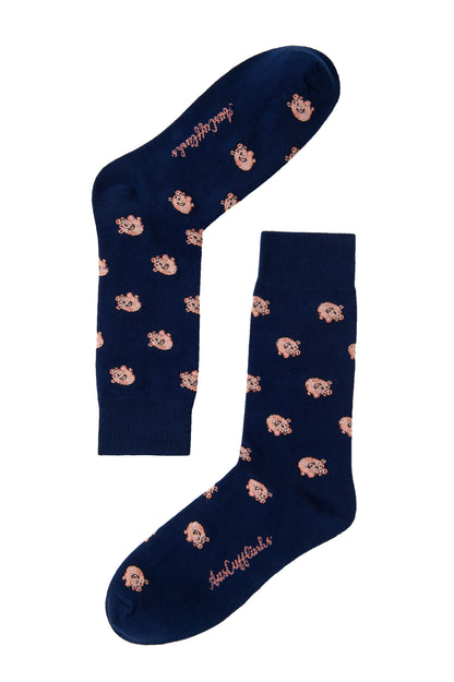 Piggy Bank Socks showcase a delightful combination of playful pink cartoon dog patterns and pink text on a navy blue background, making them both a fashion statement and the epitome of comfort.