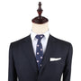 A mannequin dressed in a dark suit jacket, white dress shirt, and a Piggy Bank Slim Tie showcases formal menswear, exuding sophistication. Perfect for those looking to invest in standout attire.