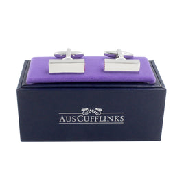 A pair of 4 Pink Stone Cufflinks in an elegant purple box.