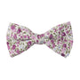 The Pink Roses Floral Bow Tie, adorned with a floral pattern of pink roses and purple flowers on a white background, adds Nature's touch to your everyday flair.