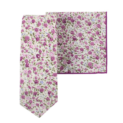 The Pink Roses Floral Cotton Skinny Tie and Pocket Square Set showcases a perennial charm with its blush blooms and purple flowers against a crisp white background.