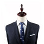 Mannequin dressed in a dark pinstripe suit, white dress shirt, and Polar Bear Slim Tie, exuding an air of elegance against a pristine white background.