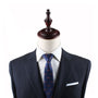 A Racing Car Slim Tie adorns a mannequin dummy, exuding an air of harmony.