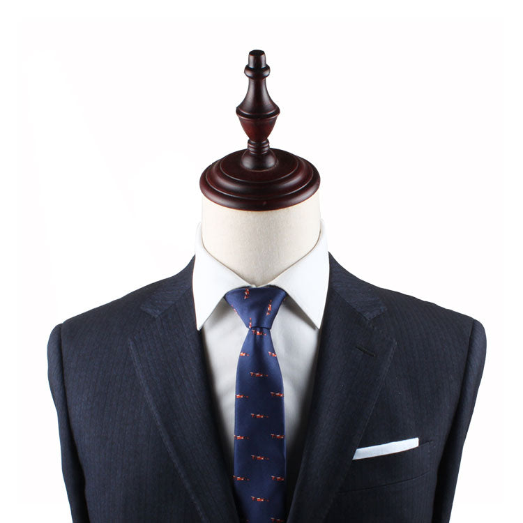 A Racing Car Slim Tie adorns a mannequin dummy, exuding an air of harmony.