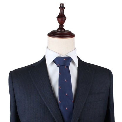 A mannequin dressed in a navy blue suit with a Red Parrot Slim Tie.