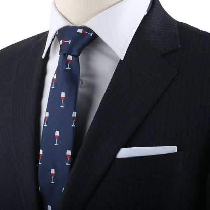 A person exudes modern charm in a black suit with a white shirt and the Wine Skinny Tie, featuring a pattern of red wine glasses, reflecting their refined taste.