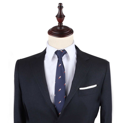 A mannequin dressed in a dark suit, white shirt, and the Rocket Slim Tie, featuring navy blue with red and white patterns, stands against a plain background, epitomizing peak elegance.