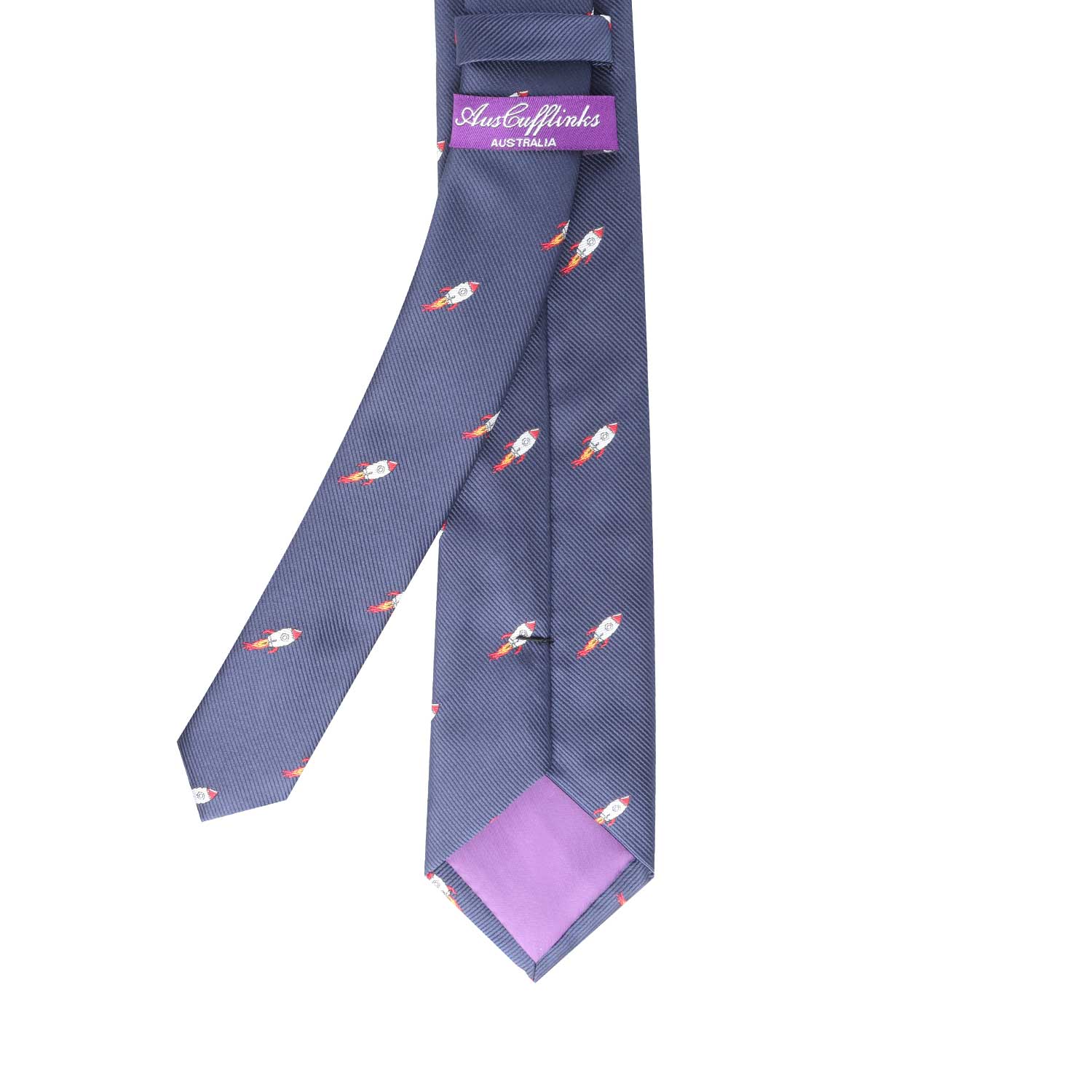 A navy blue Rocket Thin Tie with a pattern of small rockets brings peak elegance to your attire, featuring a lavender label at the back displaying "AustEmMarks Australian.