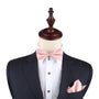 Mannequin dressed in a dark suit with a white shirt, showcasing the Rose Gold Bowtie and Pocket Square Set against a plain background for sophisticated coordination.