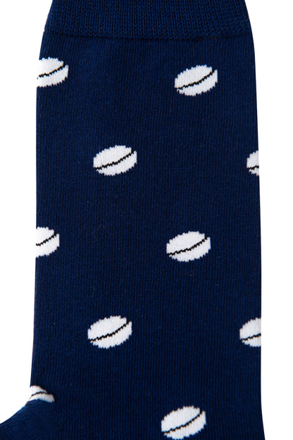 Close-up of a blue Rugby Sock featuring multiple white rugby ball patterns for a sporty stride.