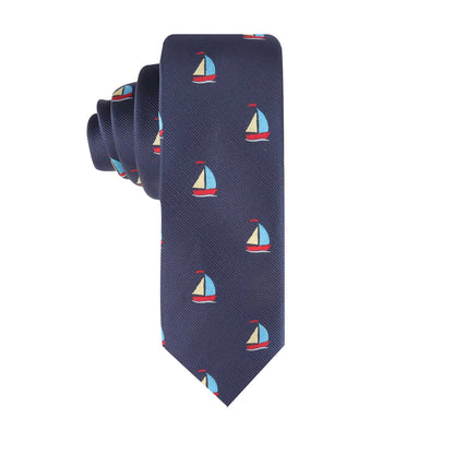 Sail Boat Thin Tie - a navy blue necktie adorned with small sailboat patterns in red, white, and blue, ideal for anyone looking to set sail in nautical style.