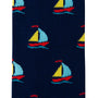 Close-up of the dark blue Sailing Socks featuring a repeated pattern of small, colorful sailboats, evoking the comfort one feels while sailing on gentle waves.