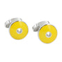 A pair of Sapphire Yellow Cufflinks, featuring silver design with round, yellow enamel faces and a central hole, exuding charm and radiant sunny tones, placed against a white background.